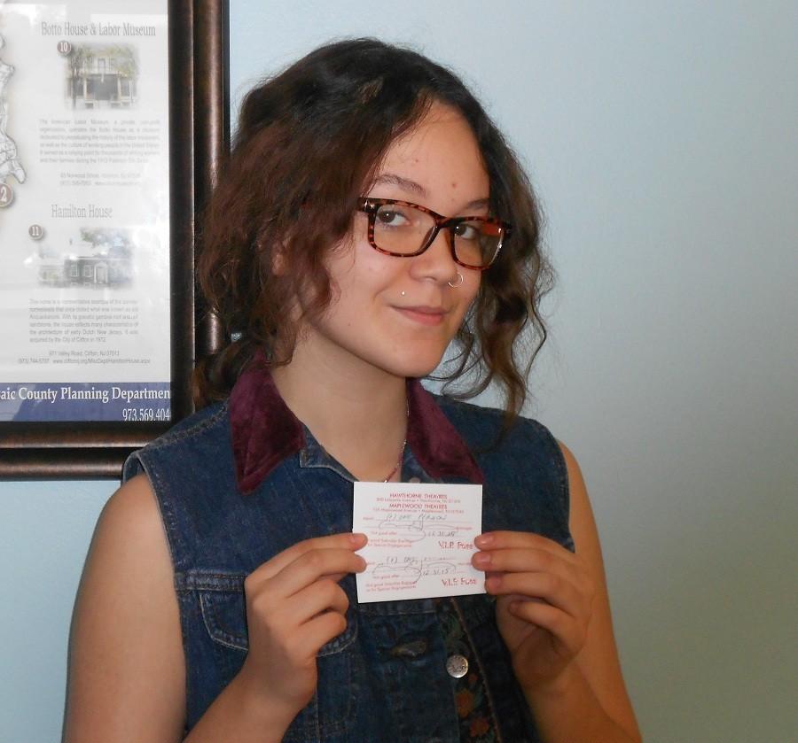 Danella Ramos with her 2 VIP tickets donated by the Hawthorne Theater