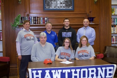 NCAA signing day for track & field athlete Kaitlin Salisbury. Back row left to right: Coaches John La Forge,  Gus Schell, Jayson La Vorne, and Athletic Director Art Mazzacca. Front row left to right: Gerald Salisbury, Kaitlin Salisbury, and Nancy Salisbury.