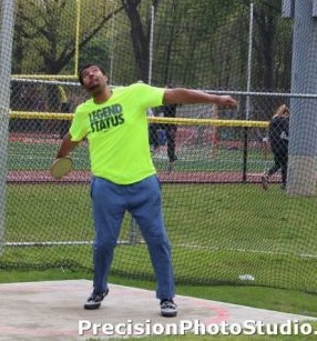 Track star Davius Bunch practicing the discus throw.