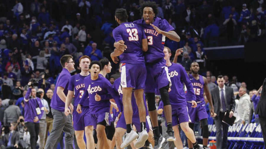 Nov 12, 2019; Lexington, KY, USA; Evansville Purple Aces guard K.J. Riley (33) celebrates with forward DeAndre Williams (13) after defeating the Kentucky Wildcats at Rupp Arena. Mandatory Credit: Mark Zerof-USA TODAY Sports