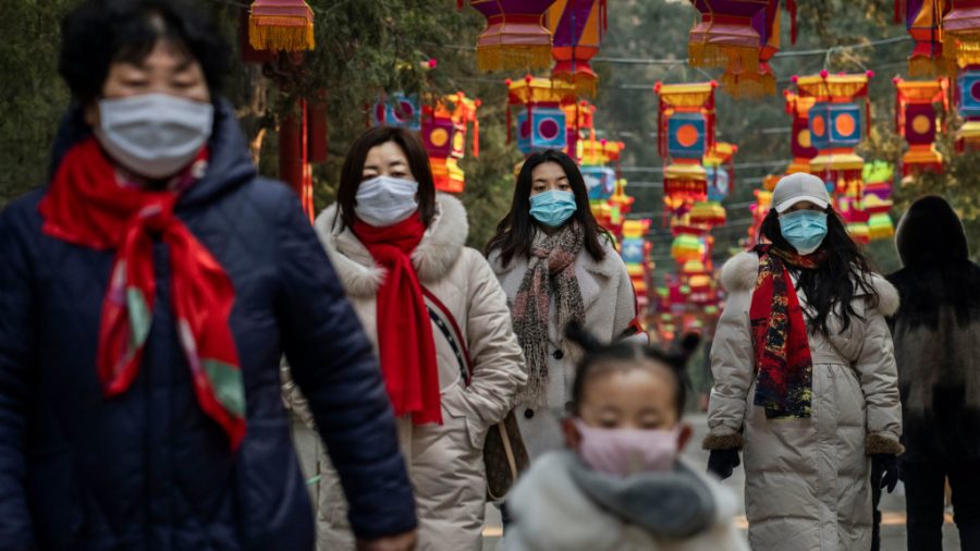 BEIJING%2C+CHINA+-+JANUARY+25%3A+Chinese+women+and+a+child+all+wear+protective+masks+as+they+walk+under+decorations+in+a+park+after+celebrations+for+the+Chinese+New+Year+and+Spring+Festival+were+cancelled+by+authorities+on+January+25%2C+2020+in+Beijing%2C+China.+The+number+of+cases+of+a+deadly+new+coronavirus+rose+to+over+1300+in+mainland+China+Saturday+as+health+officials+locked+down+the+city+of+Wuhan+earlier+in+the+week+in+an+effort+to+contain+the+spread+of+the+pneumonia-like+disease+which+medicals+experts+have+been+confirmed+can+be+passed+from+human+to+human.+In+an+unprecedented+move%2C+Chinese+authorities+put+travel+restrictions+on+the+city+of+Wuhan+and+neighbouring+cities+affecting+a+population+of+over+35+million.+The+number+of+those+who+have+died+from+the+virus+in+China+climbed+to+at+least+41+on+Saturday+and+cases+have+been+reported+in+other+countries+including+the+United+States%2C+Australia%2C+France%2C+Thailand%2C+Japan%2C+Taiwan+and+South+Korea.+%28Photo+by+Kevin+Frayer%2FGetty+Images%29