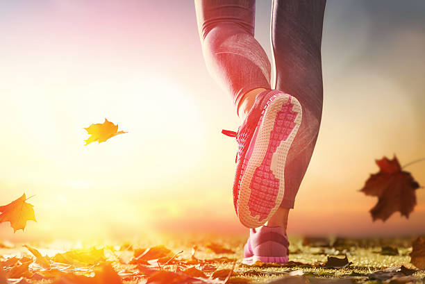 athletes foots close-up on autumn walk in nature outdoors. healthy lifestyle and sport concepts.