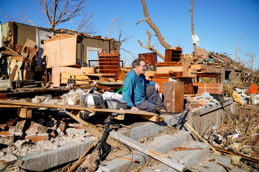Rick Foley, 70, sits outside his home after a devastating outbreak of tornadoes ripped through several U.S. states in Mayfield, Kentucky, U.S. December 11, 2021. I was in the middle of it, just trying to pull the pieces together now, said Rick who survived the storm crouched in a doorway inside his home. REUTERS/Cheney Orr     TPX IMAGES OF THE DAY