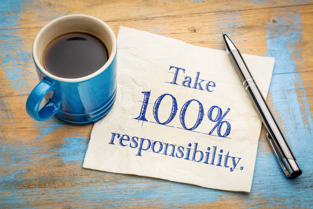 Take 100% responsibility reminder note - handwriting on a napkin